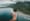 aerial view of hand holding a go pro camera with hawaii in background 